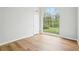 The living room features wood-look floors and an arched window at 3719 Bomar Rd, Douglasville, GA 30135