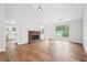Open-concept living room featuring hardwood floors, fireplace, and natural light at 3719 Bomar Rd, Douglasville, GA 30135