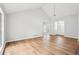 Bright living room with vaulted ceiling, hardwood floors, and natural light streaming through large windows at 3719 Bomar Rd, Douglasville, GA 30135