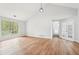 Bright living room with vaulted ceiling, hardwood floors, and big window with natural light at 3719 Bomar Rd, Douglasville, GA 30135