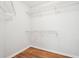 Simple walk-in closet with wire shelving and laminate flooring at 3719 Bomar Rd, Douglasville, GA 30135