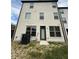 Rear exterior view of a two-story home featuring neutral toned brick and multiple windows for natural light at 4215 Almanor Cir, Norcross, GA 30071