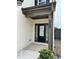 Close-up of the front door showcasing the house number and a covered entryway, offering curb appeal at 4215 Almanor Cir, Norcross, GA 30071