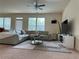 Spacious living room with large sectional sofa, creating a comfortable and stylish gathering space at 4215 Almanor Cir, Norcross, GA 30071