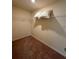 Spacious walk-in closet featuring carpet flooring, white walls, and wire shelving for optimal organization at 4215 Almanor Cir, Norcross, GA 30071