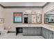 Bright bathroom with double sinks, vanity, marble counter tops, and storage at 5884 Hammersmith Rd, Stone Mountain, GA 30087