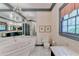 Bathroom features marble bathtub, vanity area, and decorative wallpaper at 5884 Hammersmith Rd, Stone Mountain, GA 30087