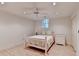 Cozy bedroom with white furniture, a ceiling fan, and neutral paint at 5884 Hammersmith Rd, Stone Mountain, GA 30087