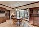 Bright dining area featuring large windows, wooden furnishings, and hardwood floors at 5884 Hammersmith Rd, Stone Mountain, GA 30087