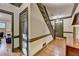 Elegant foyer features hardwood floors, staircase, and neutral color palette at 5884 Hammersmith Rd, Stone Mountain, GA 30087