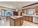 Spacious kitchen featuring a wooden island with sink, stainless steel appliances, and light wood flooring at 5884 Hammersmith Rd, Stone Mountain, GA 30087