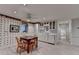 Basement kitchenette with eat in dining area, white cabinets, and sleek countertops at 5884 Hammersmith Rd, Stone Mountain, GA 30087