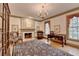 Living room with a fireplace, windows, and a patterned rug, providing a comfortable and elegant living space at 5884 Hammersmith Rd, Stone Mountain, GA 30087