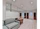 Spacious living area with mirrored wall, hardwood floors, and recessed lighting at 5884 Hammersmith Rd, Stone Mountain, GA 30087