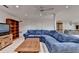 Bright basement living room with hardwood floors, comfortable seating, and ceiling fan at 5884 Hammersmith Rd, Stone Mountain, GA 30087