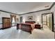 Spacious main bedroom with en-suite bathroom and dark wood furniture at 5884 Hammersmith Rd, Stone Mountain, GA 30087