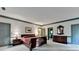 Large main bedroom boasts ample lighting, neutral colors, and dark wood furniture at 5884 Hammersmith Rd, Stone Mountain, GA 30087