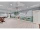 Basement playroom with mural walls, ceiling fan, and wood-look floors at 5884 Hammersmith Rd, Stone Mountain, GA 30087