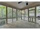 Screened-in porch with forest views, natural light, and wood floors at 5884 Hammersmith Rd, Stone Mountain, GA 30087