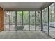 Relaxing screened porch offering a serene view of the surrounding lush greenery at 5884 Hammersmith Rd, Stone Mountain, GA 30087
