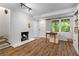 Finished basement with white brick fireplace and stylish flooring at 2336 Armand Ne Rd, Atlanta, GA 30324