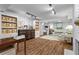Spacious basement with custom storage, ample seating, and recessed lighting at 2336 Armand Ne Rd, Atlanta, GA 30324