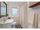 Clean bathroom with a classic black and white tiled floor at 2336 Armand Ne Rd, Atlanta, GA 30324