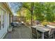 Outdoor deck with dining area, lounge seating, and lush greenery at 2336 Armand Ne Rd, Atlanta, GA 30324