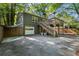 Home exterior with garage, driveway, elevated deck, and stairs to the back yard at 2336 Armand Ne Rd, Atlanta, GA 30324