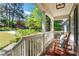 Inviting front porch with rocking chairs, white railings, and a peaceful view of the neighborhood at 2336 Armand Ne Rd, Atlanta, GA 30324
