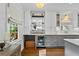 Elegant kitchen showcases white and gray cabinets and a sleek wine refrigerator at 2336 Armand Ne Rd, Atlanta, GA 30324