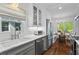 Updated kitchen with stainless steel appliances, marble countertops, and an adjacent breakfast nook at 2336 Armand Ne Rd, Atlanta, GA 30324
