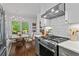Well-designed kitchen with gas range, stainless appliances, and view of the backyard at 2336 Armand Ne Rd, Atlanta, GA 30324