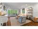 Elegant living room with hardwood floors, a cozy seating area, and bright french doors to outside at 2336 Armand Ne Rd, Atlanta, GA 30324