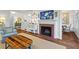 Cozy living room featuring a fireplace, hardwood floors, and stylish decor elements at 2336 Armand Ne Rd, Atlanta, GA 30324