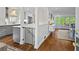 Open-concept living space flows into the kitchen, featuring hardwood floors and natural light at 2336 Armand Ne Rd, Atlanta, GA 30324