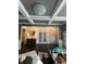 Elegant foyer with dark hardwood floors, white wainscoting, and a decorative ceiling with recessed lighting at 3716 Derringer Rdg, Loganville, GA 30052