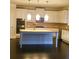 Bright kitchen featuring white cabinets, a kitchen island, granite countertops, and stainless steel appliances at 3716 Derringer Rdg, Loganville, GA 30052