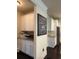 Pantry area with white cabinets, granite countertops, stainless steel appliances in an open layout at 3716 Derringer Rdg, Loganville, GA 30052