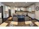 Spacious kitchen with white cabinetry, granite countertops, stainless steel appliances, and a large island at 3716 Derringer Rdg, Loganville, GA 30052