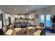Spacious kitchen with white cabinetry, granite countertops, stainless steel appliances, and a large island at 3716 Derringer Rdg, Loganville, GA 30052