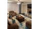 Inviting living room with a stone fireplace, plush seating, and a stylish area rug creating a cozy atmosphere at 3716 Derringer Rdg, Loganville, GA 30052
