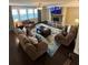 Cozy living room with plush sofas, fireplace, and an open layout perfect for entertaining at 3716 Derringer Rdg, Loganville, GA 30052