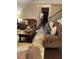 Inviting living room with a stone fireplace, plush seating, and a stylish area rug creating a cozy atmosphere at 3716 Derringer Rdg, Loganville, GA 30052