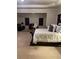 Large main bedroom featuring a sitting area, a ceiling fan, carpet, and ample natural light at 3716 Derringer Rdg, Loganville, GA 30052