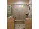 Newly tiled shower stall featuring a glass door, showerhead, and built-in niche at 3716 Derringer Rdg, Loganville, GA 30052