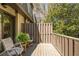 Charming balcony with wood deck, a small table, chairs, and a lovely view, perfect for enjoying the outdoors at 39 Ivy Gates Ne, Atlanta, GA 30342