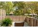 Cozy balcony with wood railing, lush greenery, and a comfortable chair, ideal for outdoor relaxation at 39 Ivy Gates Ne, Atlanta, GA 30342