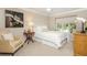 Comfortable bedroom with a soft carpet, a large window, and a cozy reading nook, perfect for relaxation at 39 Ivy Gates Ne, Atlanta, GA 30342