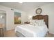 Bright bedroom featuring a decorative headboard, side table, and ensuite bathroom at 39 Ivy Gates Ne, Atlanta, GA 30342